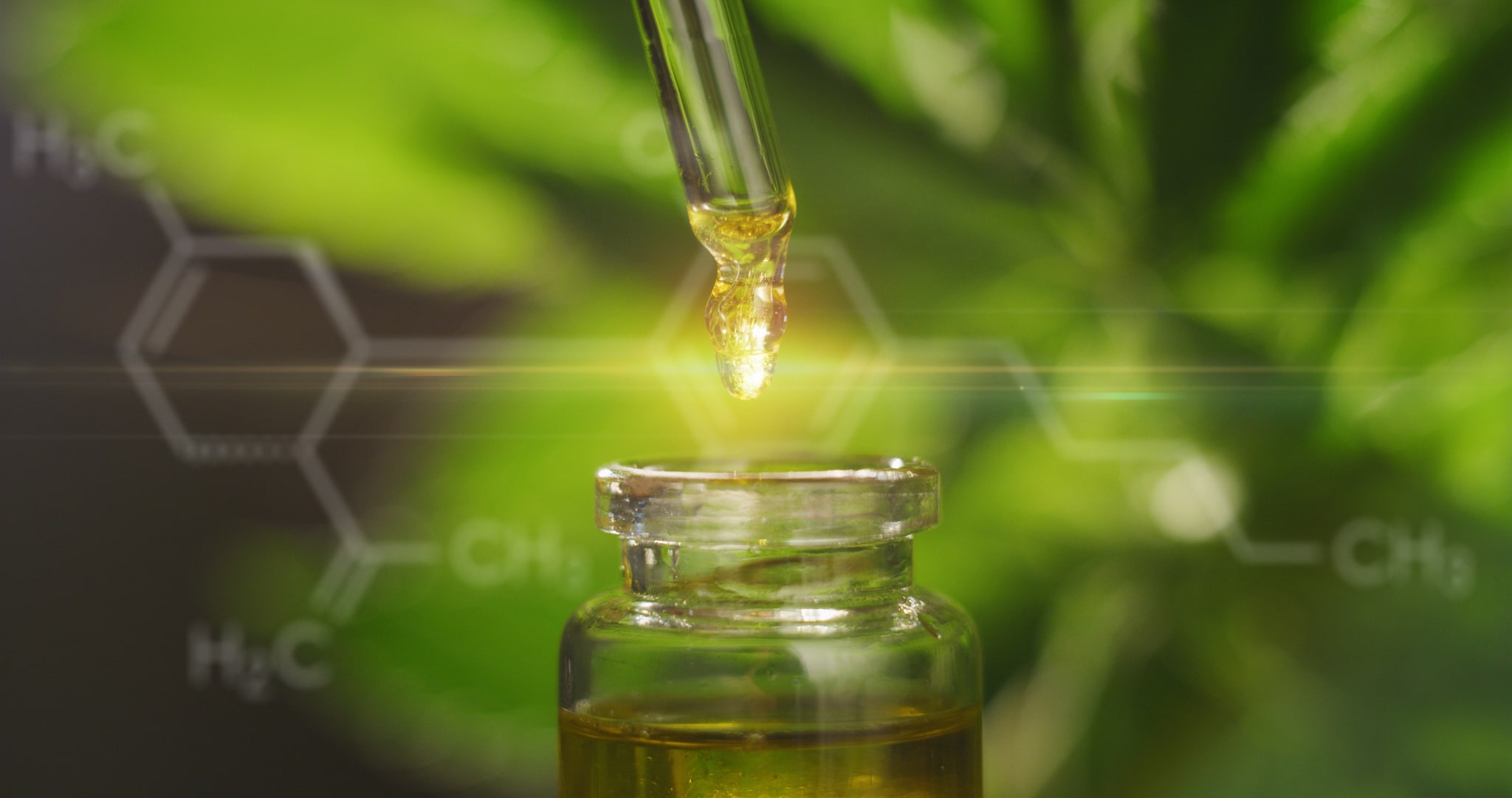 A jar with remedy concentrated cannabis oil on a green background with chemical formulas