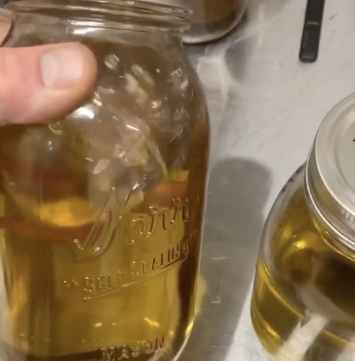 remediated THC oil in a jar