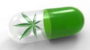 A pill with a cannabis leaf on it.